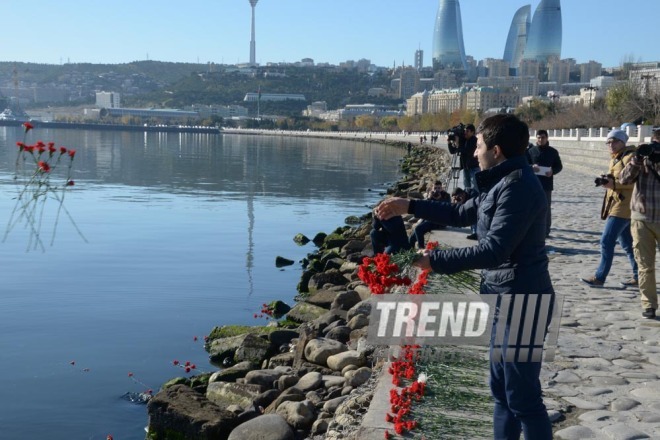 Baku residents bringing flowers to Seaside Boulevard to honor missing oil workers.  Azerbaijan, Dec.07, 2015